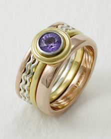 `Commisioned Stacking Ring in mixed metals with mauve Sapphire 
